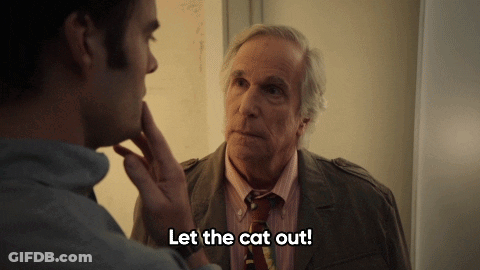 Man In Suit Telling Let The Cat Out GIF