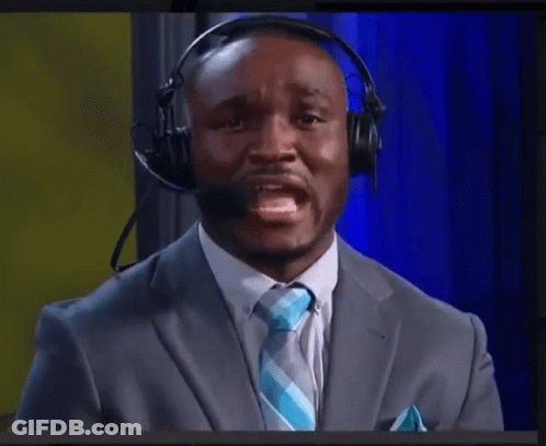 A Man In A Suit And Tie Wearing A Headset GIF