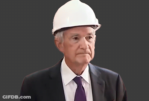 A Man In A Suit And Tie Wears A Hard Hat GIF