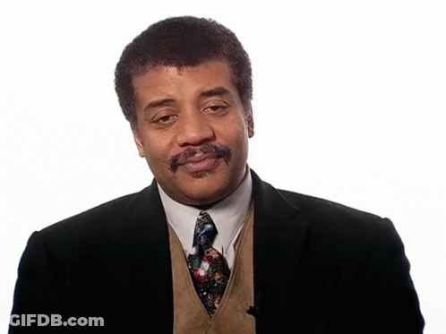 A Man In A Suit And Tie With A Beard GIF