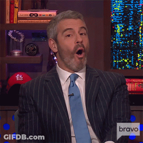 Man In Suit And Tie With Bravo Logo GIF