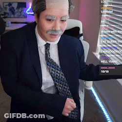 A Man In A Suit And Tie With A Fake Mustache GIF