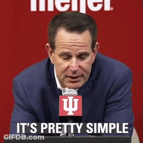 A Man In A Suit And Tie With A Microphone That Says It 'S Pretty Simple GIF