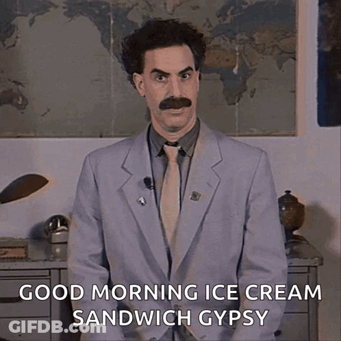 A Man In A Suit And Tie With A Mustache Says Good Morning Ice Cream Sandwich Gypsy GIF