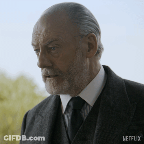 Man In Suit With Netflix Logo GIF