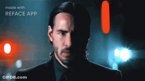 A Man In A Suit And Tie With A Reface App Logo On The Bottom GIF