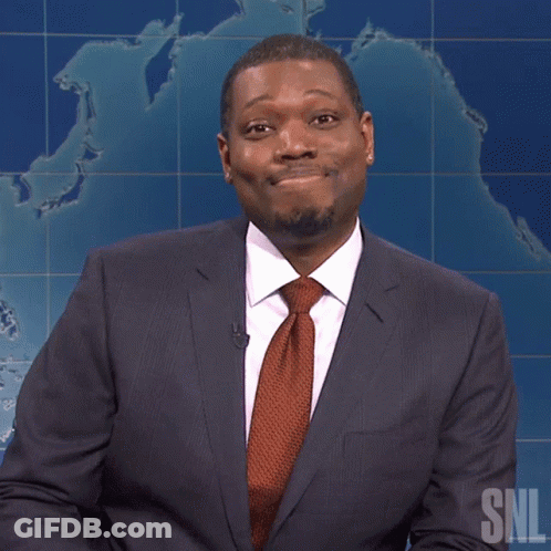 A Man In A Suit And Tie With A Snl Logo On The Bottom GIF