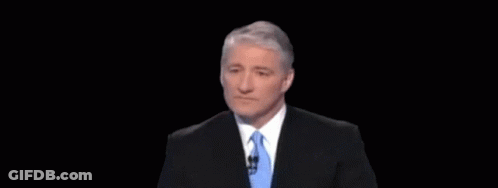 A Man In A Suit And Tie With An Optical Illusion Behind Him GIF