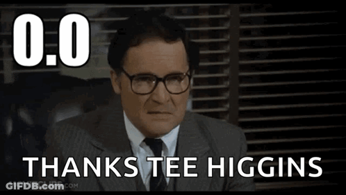 A Man In A Suit And Tie With Glasses Says Thanks Tee Higgins GIF