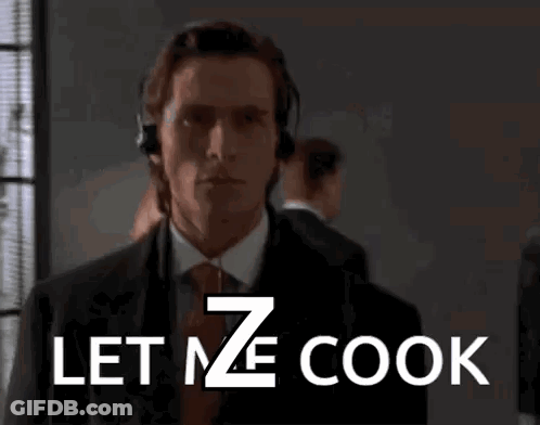 A Man In A Suit And Tie With Headphones On Says Let Me Cook GIF