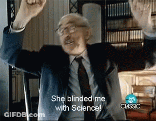 A Man In A Suit And Tie With His Arms In The Air Says She Blinded Me With Science GIF