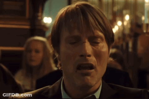 A Man In A Suit And Tie With His Mouth Open GIF