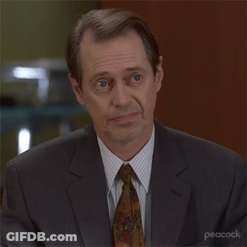 A Man In A Suit And Tie With Peacock Written On The Bottom Right GIF