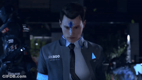A Man In A Suit And Tie With Rk800 Written On His Chest GIF
