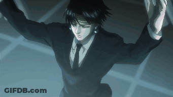 A Man In A Suit And Tie With The Letter H On His Chest GIF