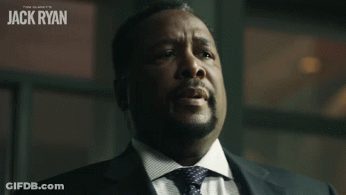 A Man In A Suit And Tie With The Name Jack Ryan On The Top GIF