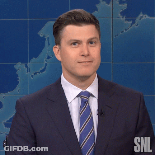 A Man In A Suit And Tie With The Snl Logo On The Bottom GIF
