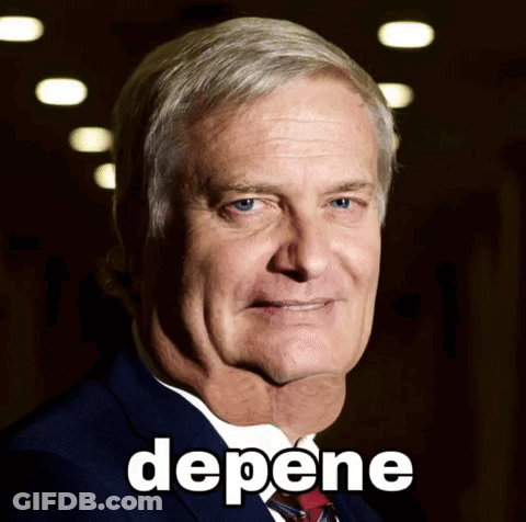A Man In A Suit And Tie With The Word Depene Written On His Face GIF
