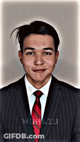 A Man In A Suit And Tie With The Word Wunazu Written On The Bottom GIF