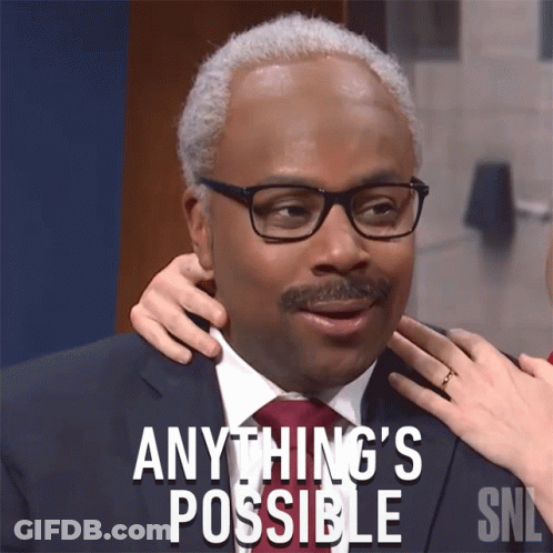 A Man In A Suit And Tie With The Words " Anything 'S Possible " Above Him GIF