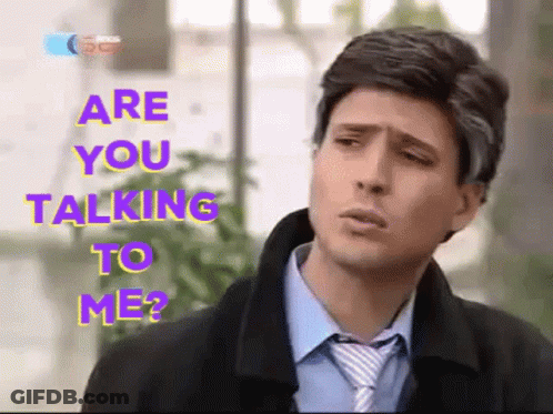 A Man In A Suit And Tie With The Words Are You Talking To Me GIF