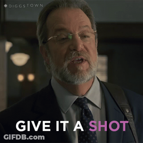 A Man In A Suit And Tie With The Words Give It A Shot Below Him GIF