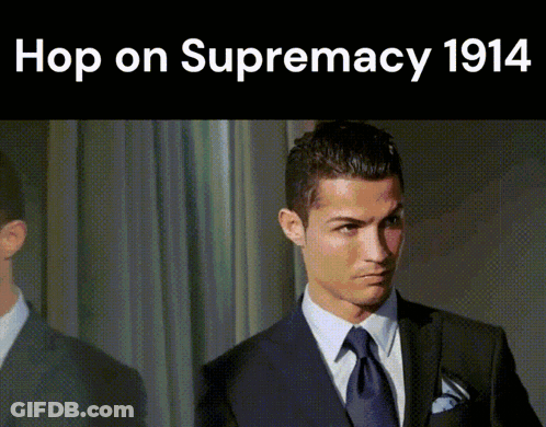 A Man In A Suit And Tie With The Words Hop On Supremacy 1914 Below Him GIF