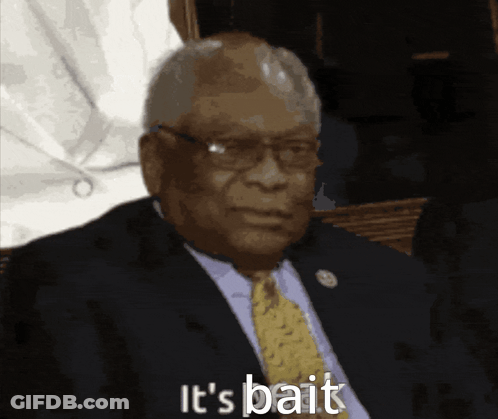 A Man In A Suit And Tie With The Words It 'S Bait Below Him GIF