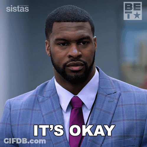 A Man In A Suit And Tie With The Words It 'S Okay Below Him GIF