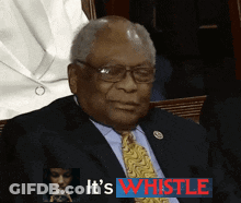A Man In A Suit And Tie With The Words It 'S Whistle Behind Him GIF