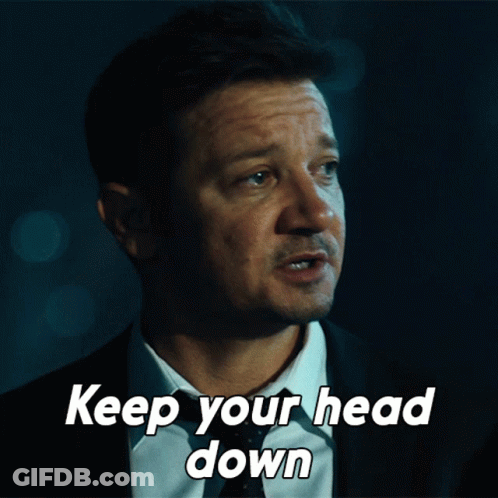 A Man In A Suit And Tie With The Words Keep Your Head Down GIF
