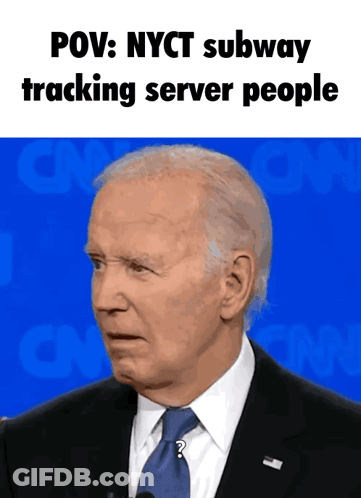 A Man In A Suit And Tie With The Words POV Nyct Subway Tracking Server People Above Him GIF