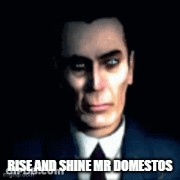 A Man In A Suit And Tie With The Words Rise And Shine Mr Domestos Written Below Him . GIF