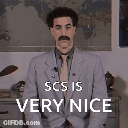 A Man In A Suit And Tie With The Words Scs Is Very Nice Above Him GIF