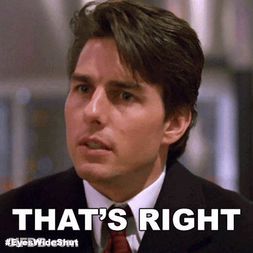A Man In A Suit And Tie With The Words That 'S Right Below Him GIF