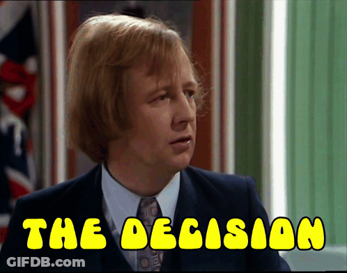 A Man In A Suit And Tie With The Words " The Decision " Below Him GIF