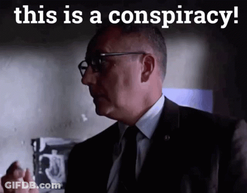 A Man In A Suit And Tie With The Words This Is A Conspiracy Below Him GIF