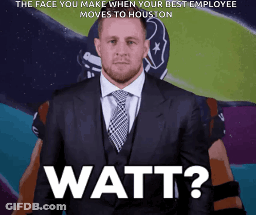 A Man In A Suit And Tie With The Words Watt On The Bottom Right GIF