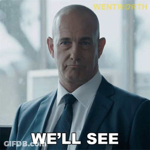 A Man In A Suit And Tie With The Words We 'Ll See Below Him GIF