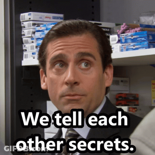 A Man In A Suit And Tie With The Words We Tell Each Other Secrets Below Him GIF