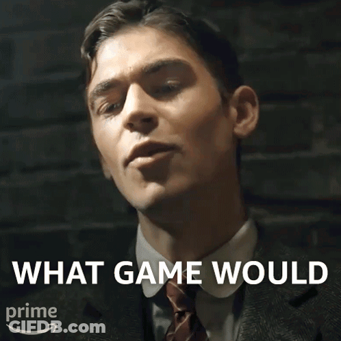 A Man In A Suit And Tie With The Words What Game Would Above Him GIF