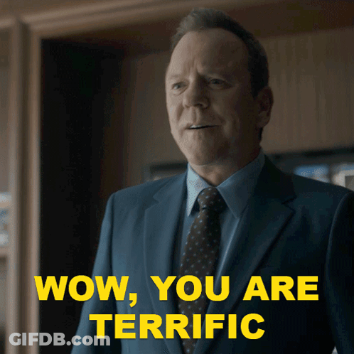 A Man In A Suit And Tie With The Words Wow You Are Terrific Behind Him GIF