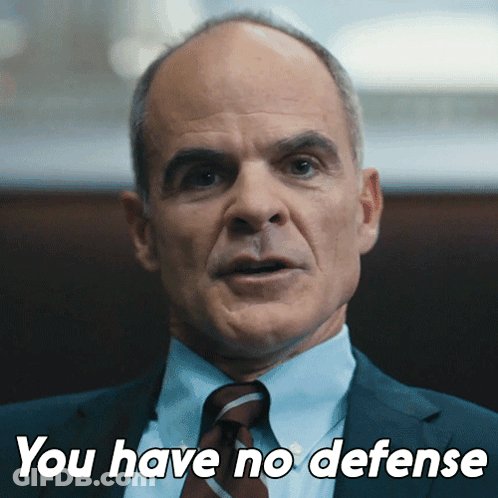 A Man In A Suit And Tie With The Words You Have No Defense Below Him GIF