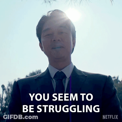 A Man In A Suit And Tie With The Words You Seem To Be Struggling On The Bottom GIF