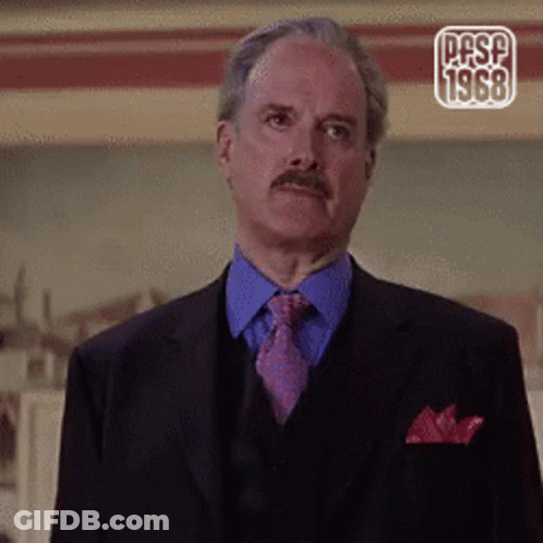 A Man In A Suit And Tie With The Year 1968 On The Corner GIF