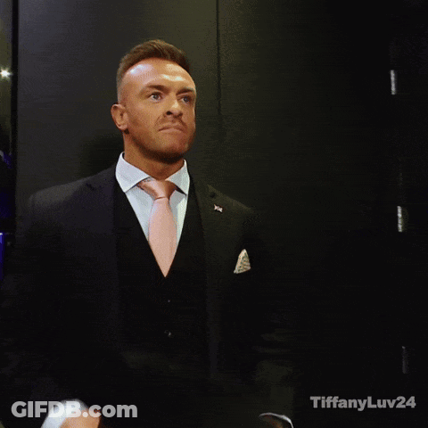 A Man In A Suit And Tie With Tiffanyluv24 Written On The Bottom Right GIF