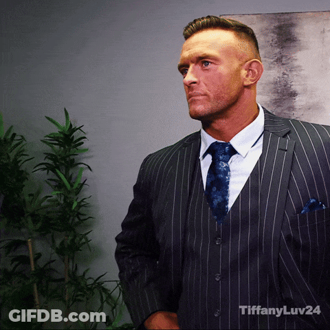 A Man In A Suit And Tie With Tiffanyluv24 Written On The Bottom Right GIF