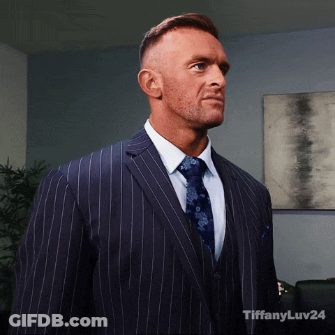 A Man In A Suit And Tie With Tiffanyluv24 Written On The Bottom Right GIF