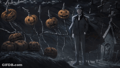 A Man In A Suit And Top Hat Holds A Pumpkin With A Face Carved Into It GIF