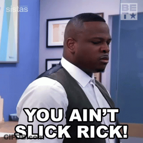A Man In A Suit And Vest Is Saying You Ain 'T Slick Rick . GIF